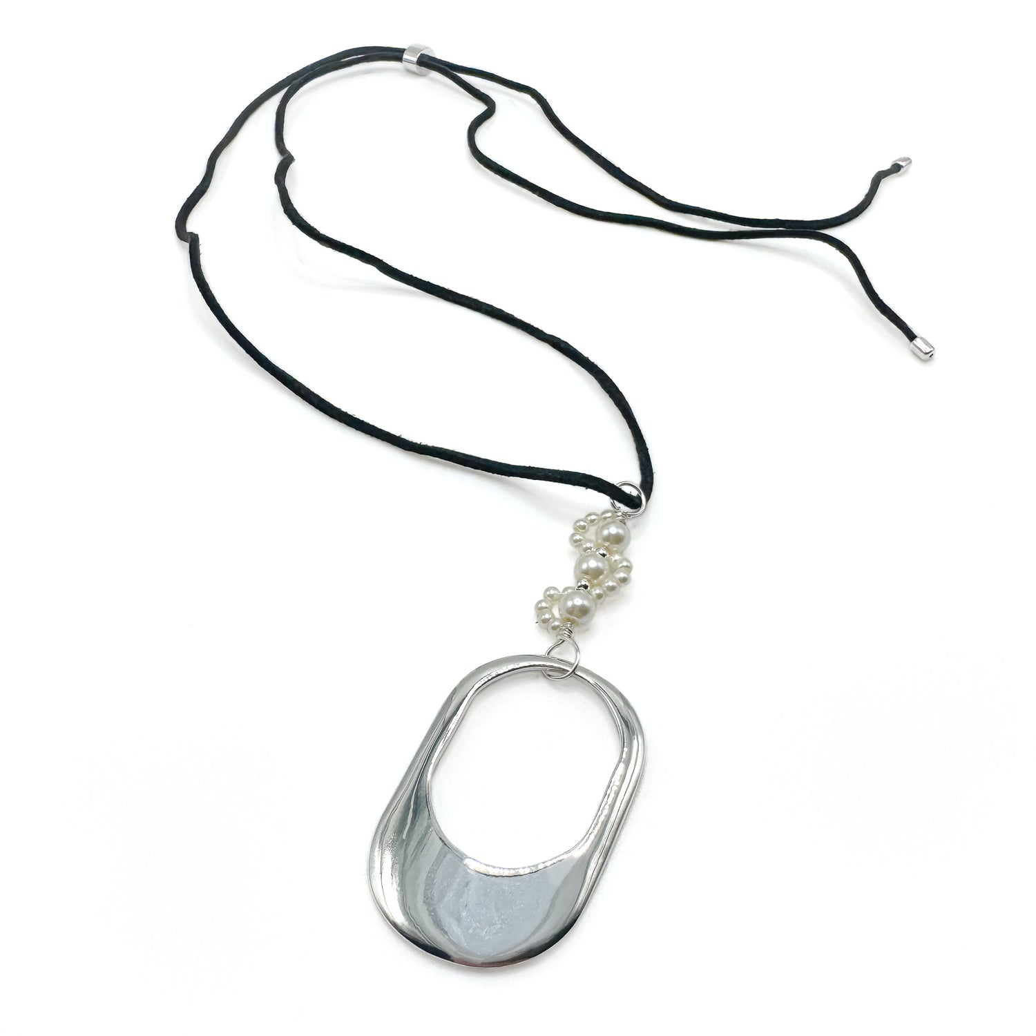 Necklace with a large silver pendant and smaller beads on a black cord against a white background