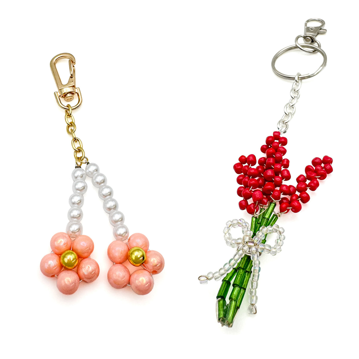 Pair of bag charms including peach blossom gold bag charm with pink, gold, and pearl beaded flowers and silver flower bouquet charm with red and green flowers