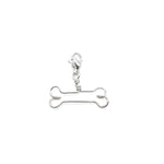 Silver bone-shaped charm on a white background