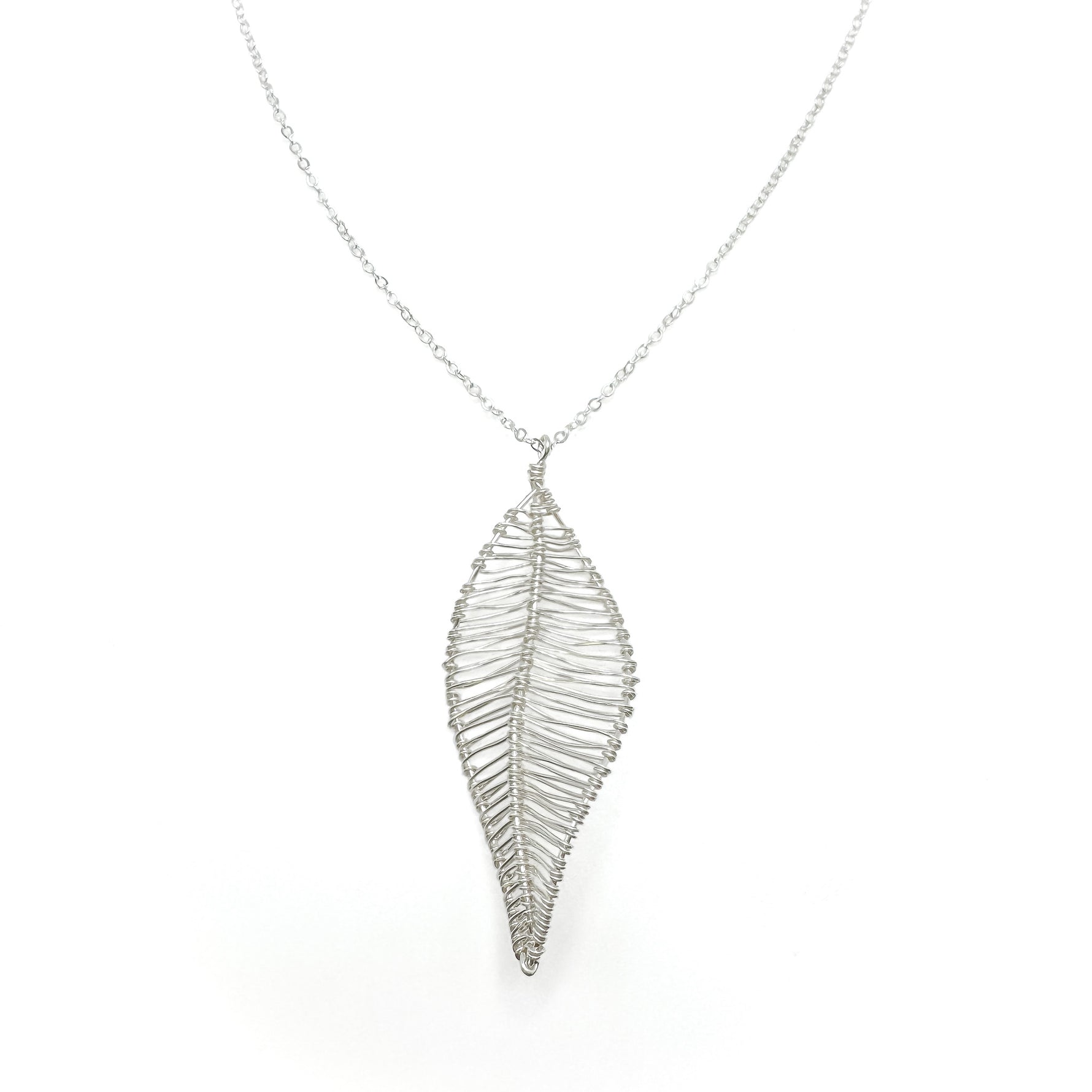 Silver long necklace with wire-wrapped leaf pendant