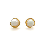 Pair of pearl earrings with gold frames on a white background