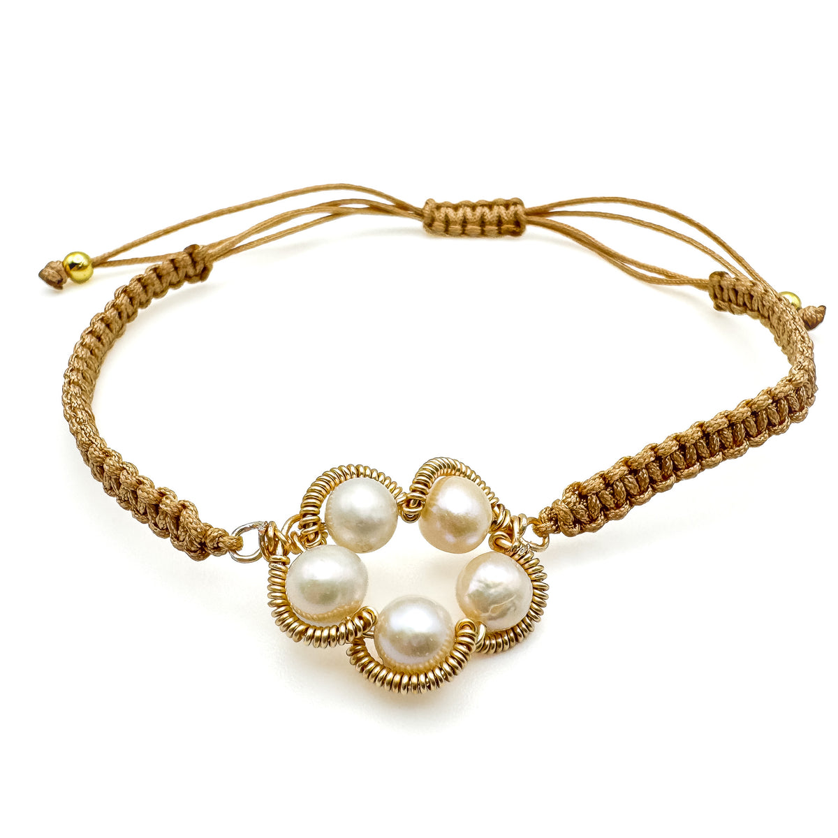 Adjustable macramé cord bracelet with gold wire-wrapped pearl flower charm
