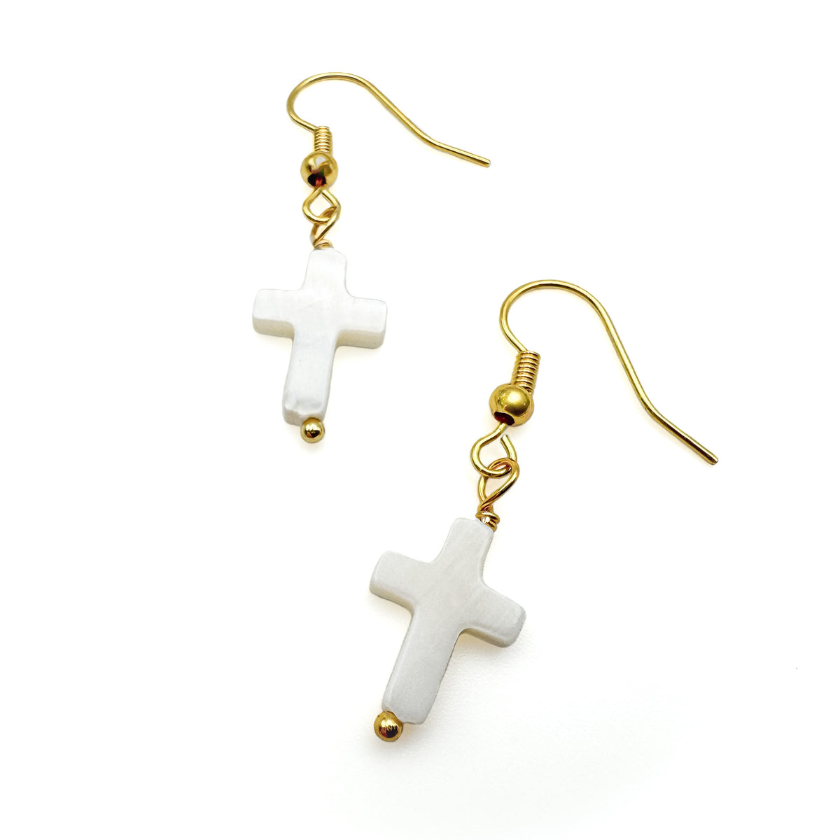 Gold and mother of pearl cross dangle earrings
