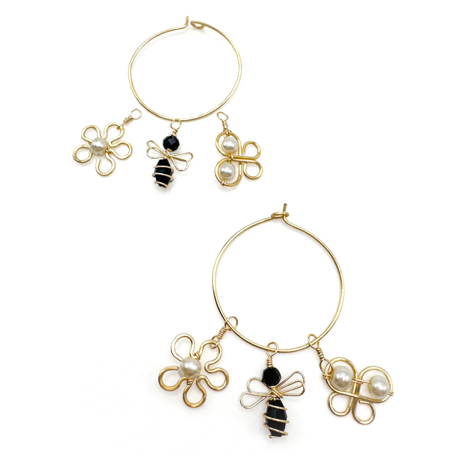 Charmed gold hoop earrings with interchangeable charms