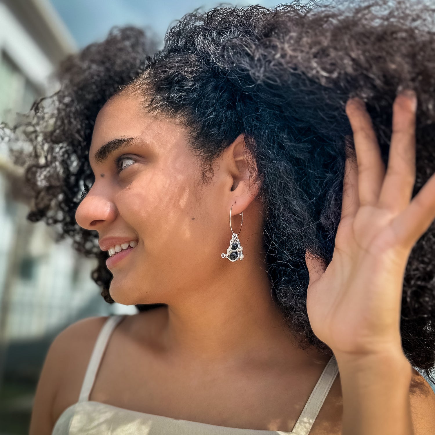 Charmed silver hoop earrings with interchangeable charms