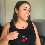 Red cherry gold jewelry modeled