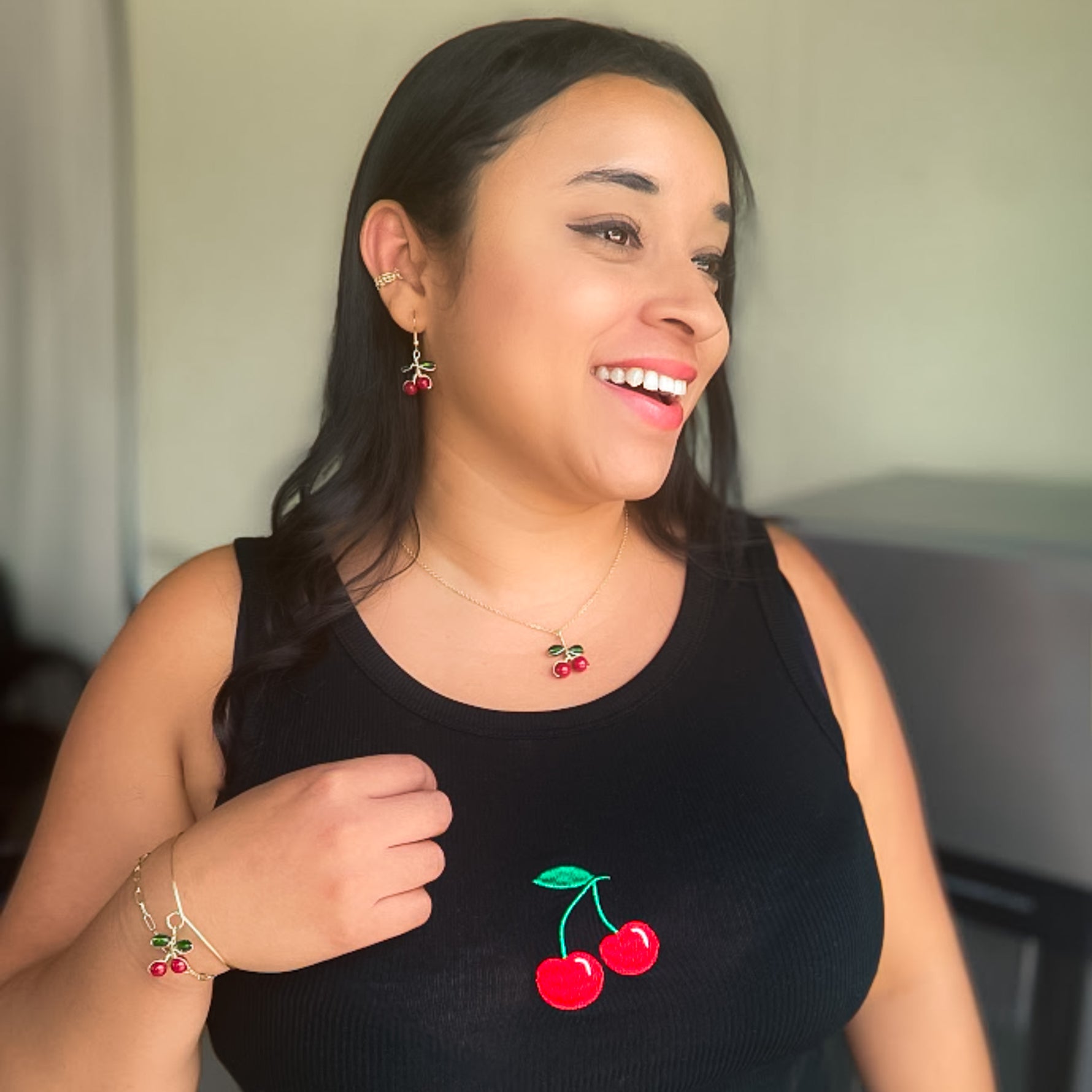 Red cherry gold jewelry modeled