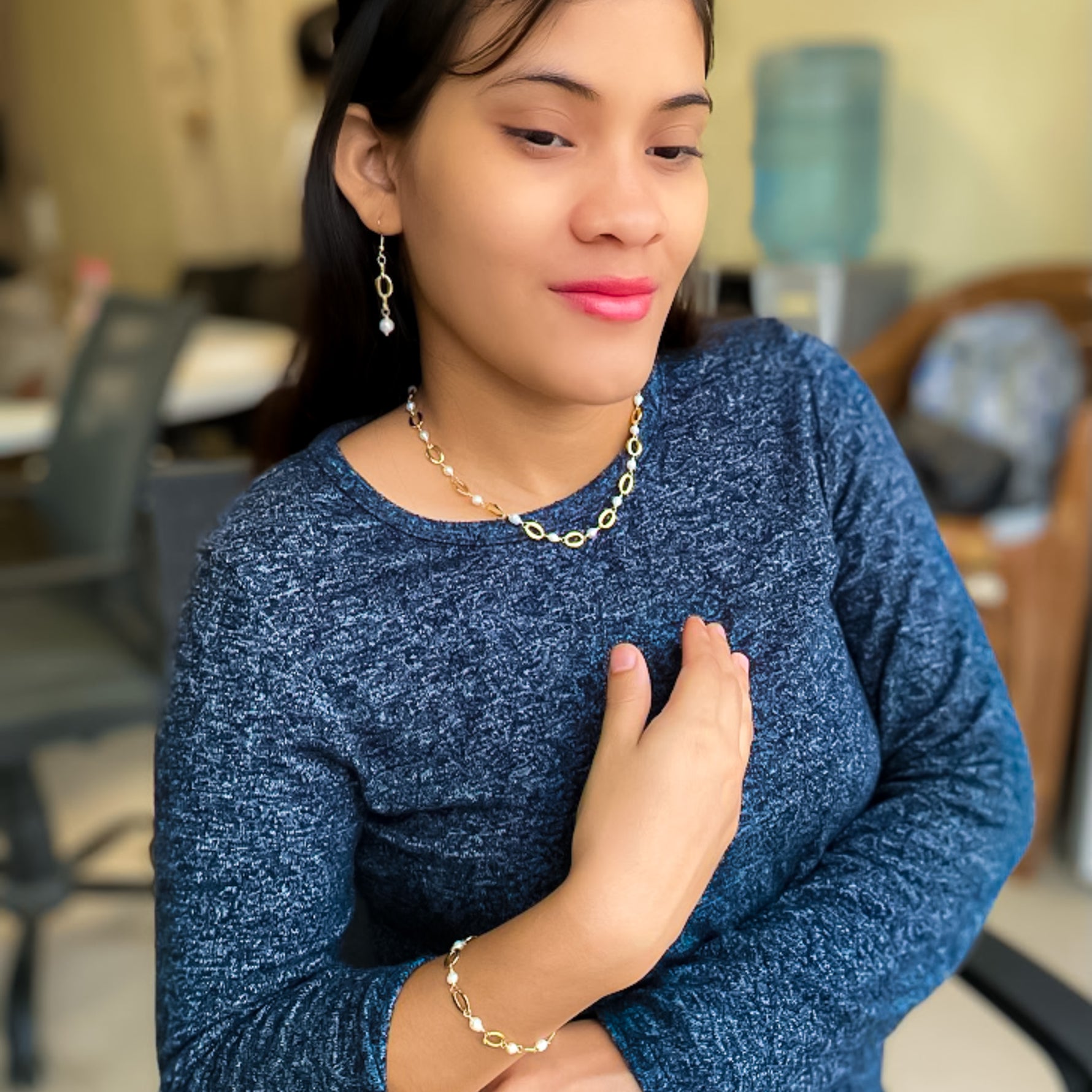 Gold pearl chain jewelry modeled