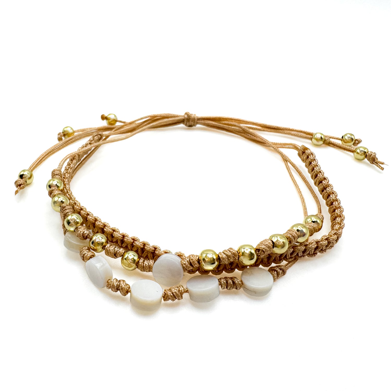 Adjustable tan cord multi-strand macrame bracelet with gold spacer beads and circle mother of pearl beads