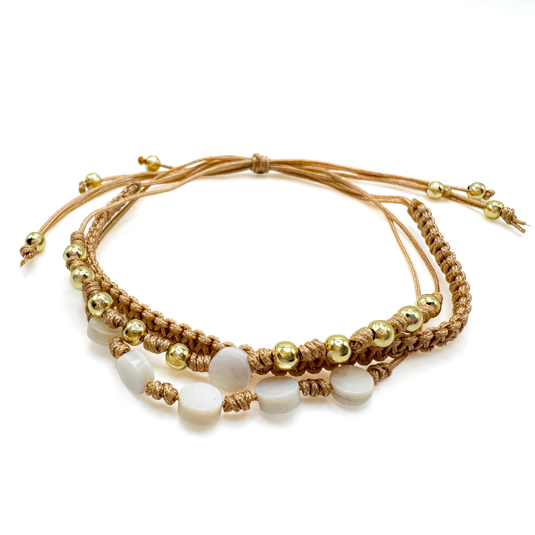 Adjustable tan cord multi-strand macrame bracelet with gold spacer beads and circle mother of pearl beads