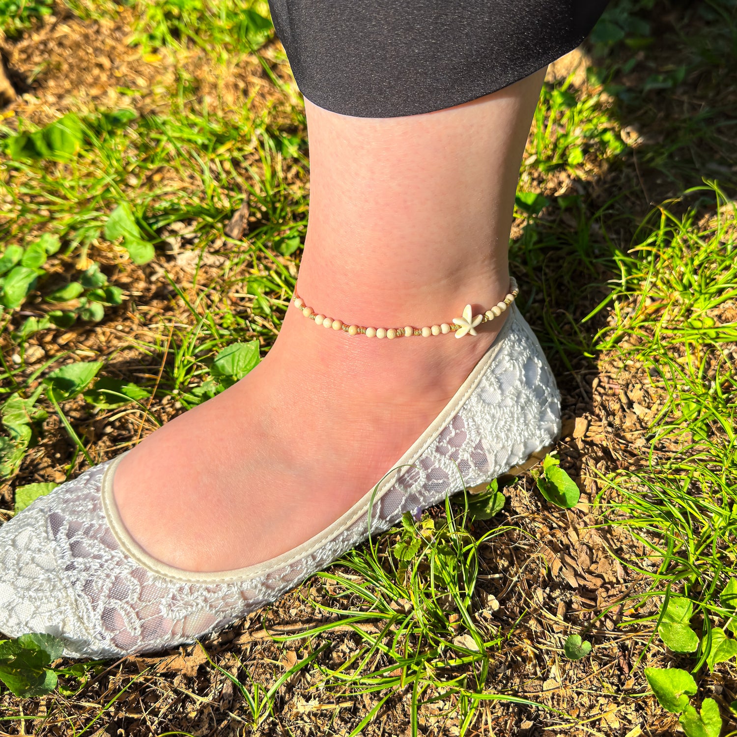 White fossil jade adjustable anklet with cream starfish bead