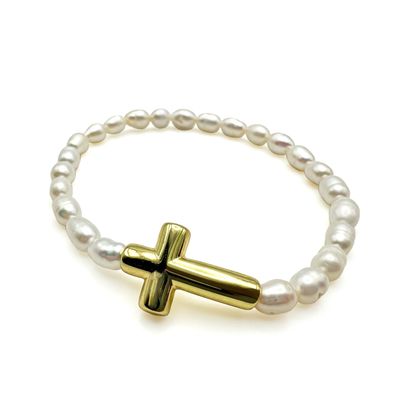 Freshwater rice pearl stretch bracelet with gold sideways cross charm