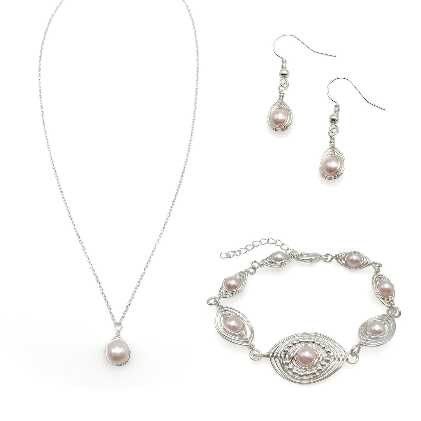 Pearl jewelry set with necklace, bracelet, and earrings on a white background