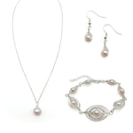 Pearl jewelry set with necklace, bracelet, and earrings on a white background