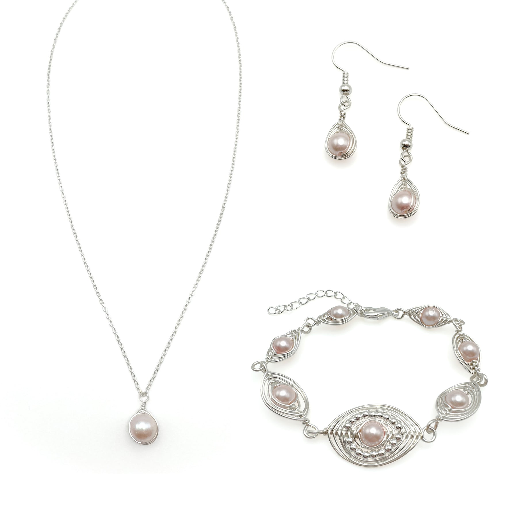 Pearl jewelry set with necklace, bracelet, and earrings on a white background