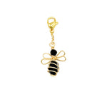 Gold and black bee-shaped charm on a white background