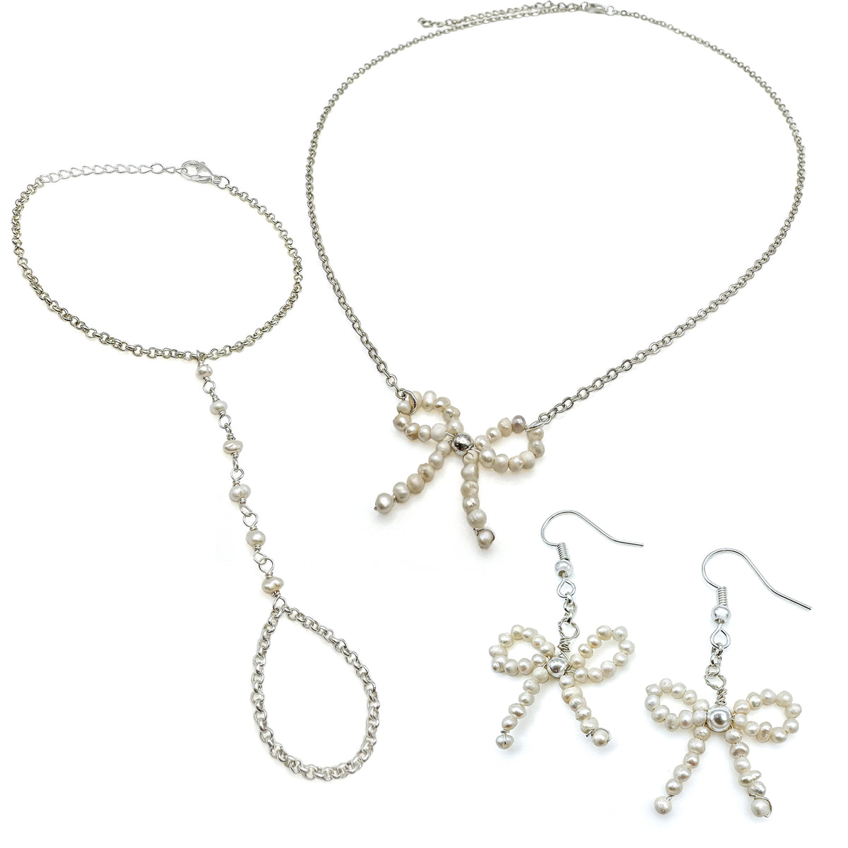 Silver and pearl jewelry set including pearl beaded ribbon dangle earrings, pearl ribbon pendant necklace, and delicate hand chain