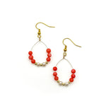 Gold teardrop dangle earrings with coral agate, gold, and freshwater pearl beads