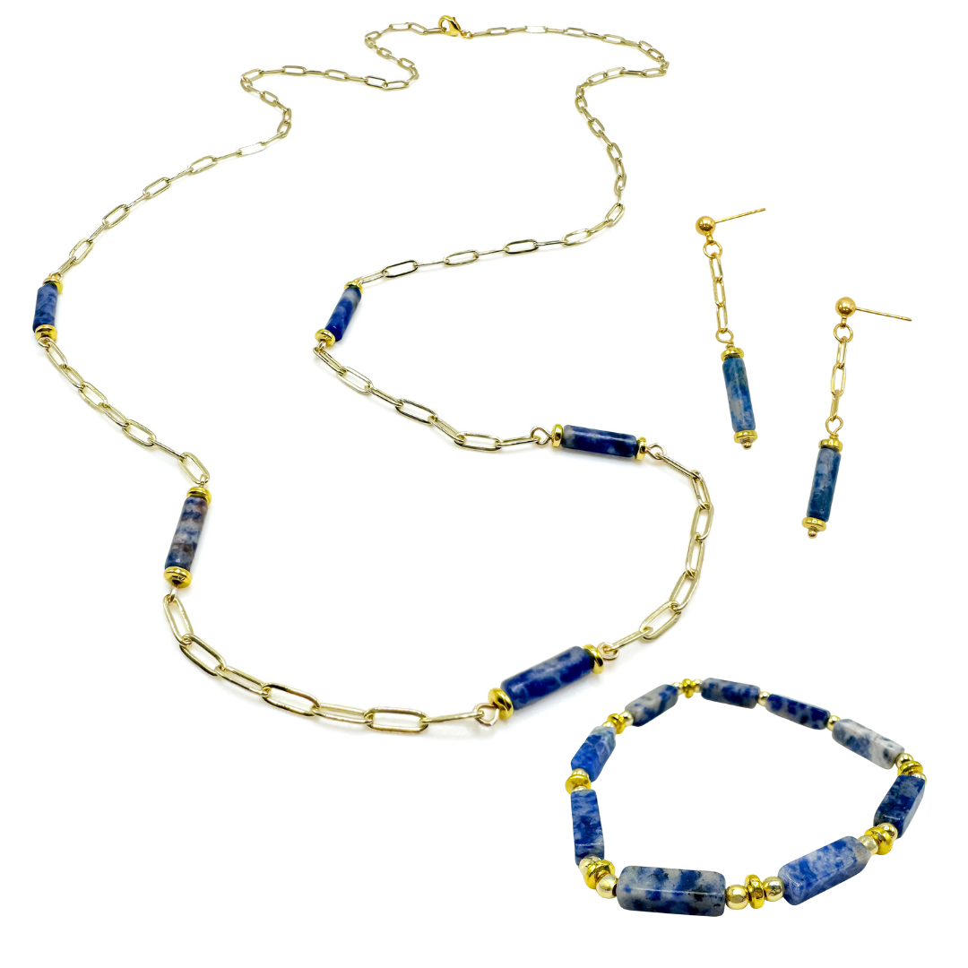Gold and blue cylindrical agate jewelry set with dangle earrings, beaded stretch bracelet, and long, paperclip chain necklace with agate stations