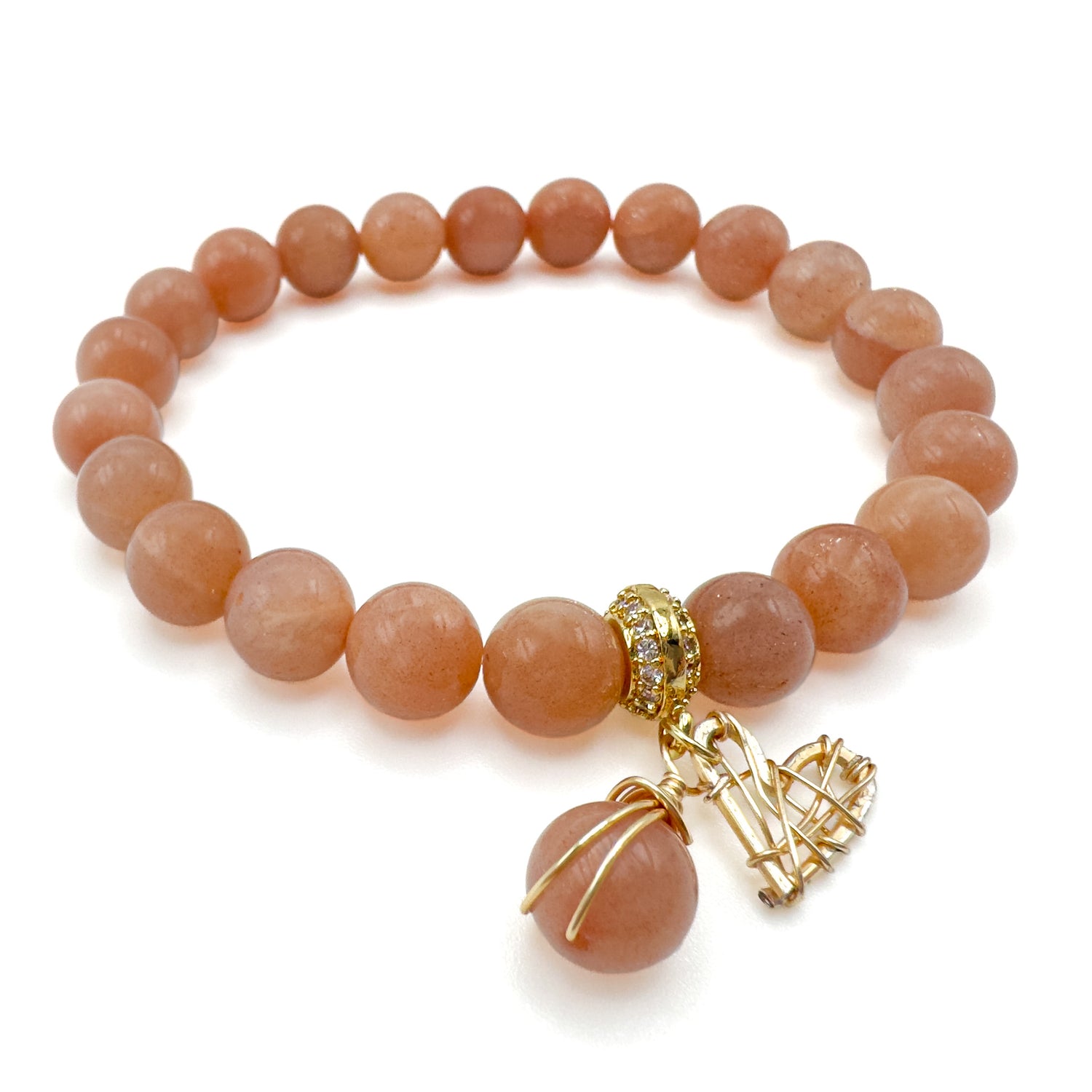 Lovely peach moonstone and gold heart charm stretch bracelet