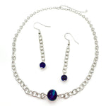 Long silver chain dangle earrings ending in blue agate and chain choker necklace with blue agate bead