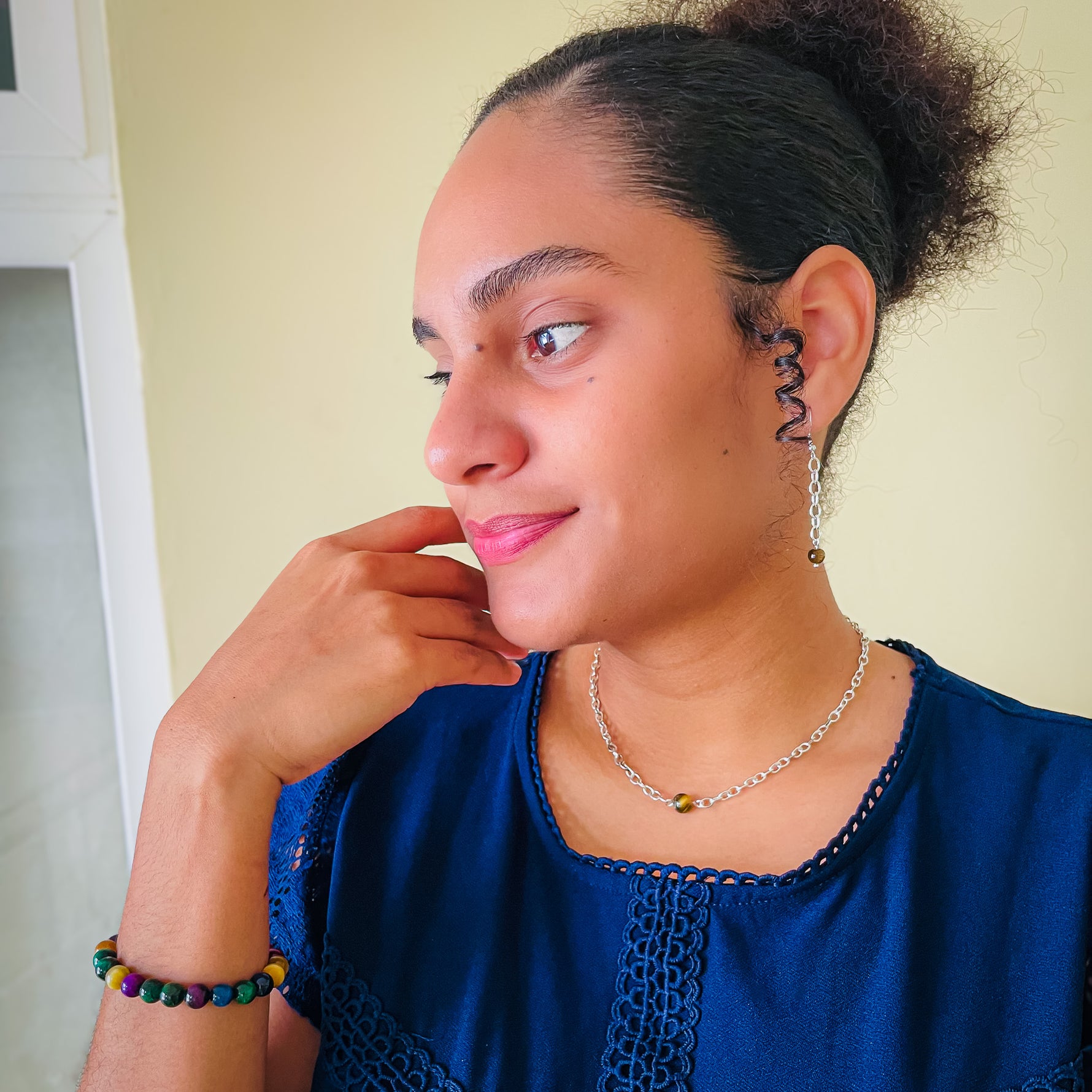 Woman modeling silver chain dangle earrings and choker necklace with brown agate bead and multicolor agate stretch bracelet