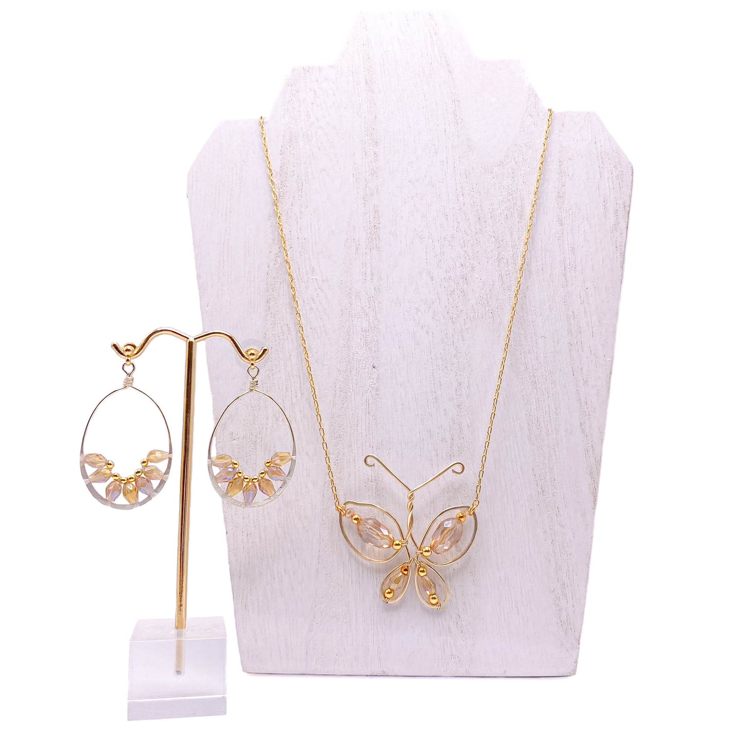 Gold crystal butterfly jewelry displayed