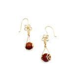 Gold dangle earrings with intricate flower wirework hook and goldstone drop