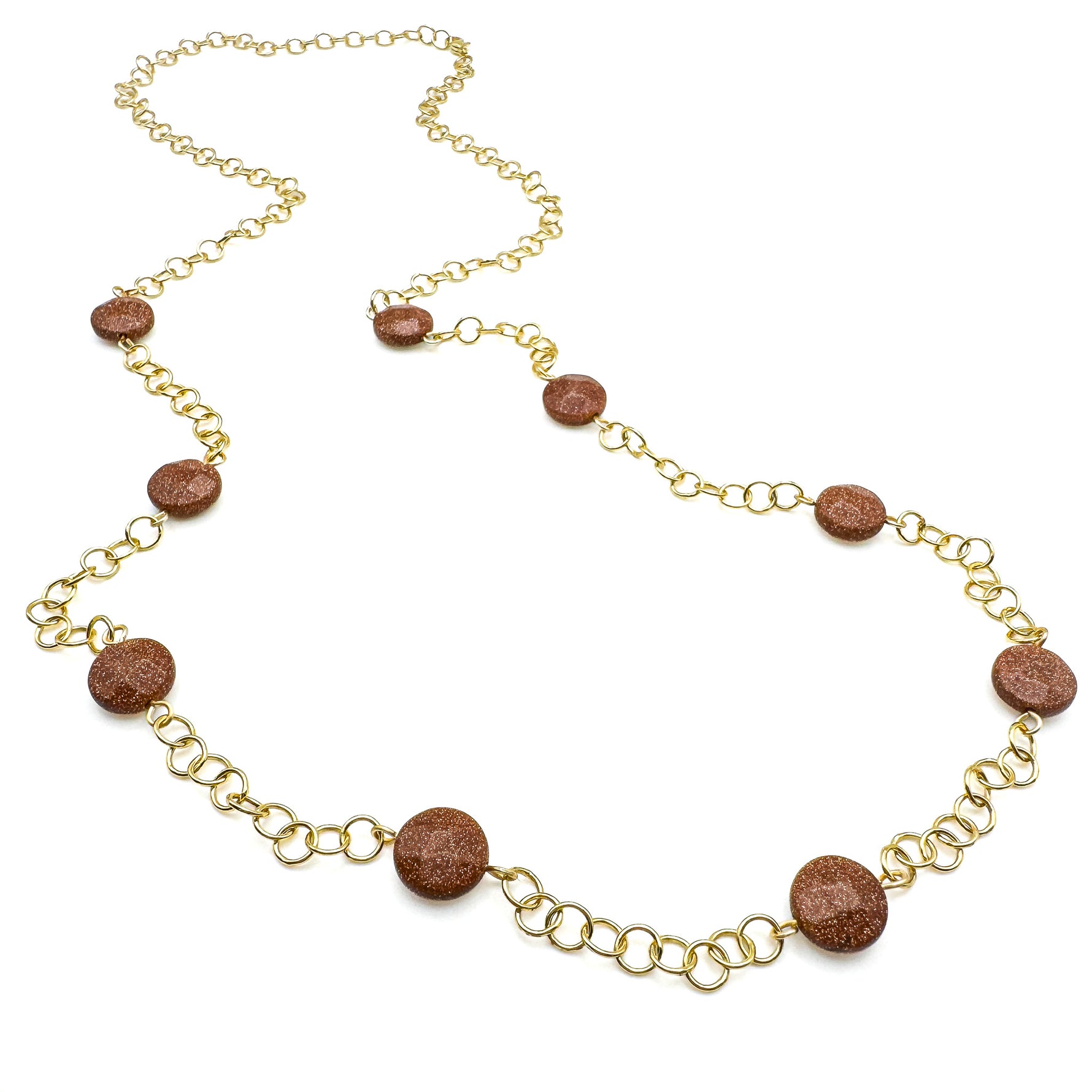 Long gold necklace with circular chain and stationed goldstone disk beads