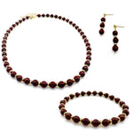 Dark brown agate and gold beaded jewelry set with drop earrings, stretch bracelet, and short statement necklace