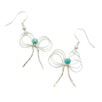 Silver wire bow dangle earrings with turquoise crystal