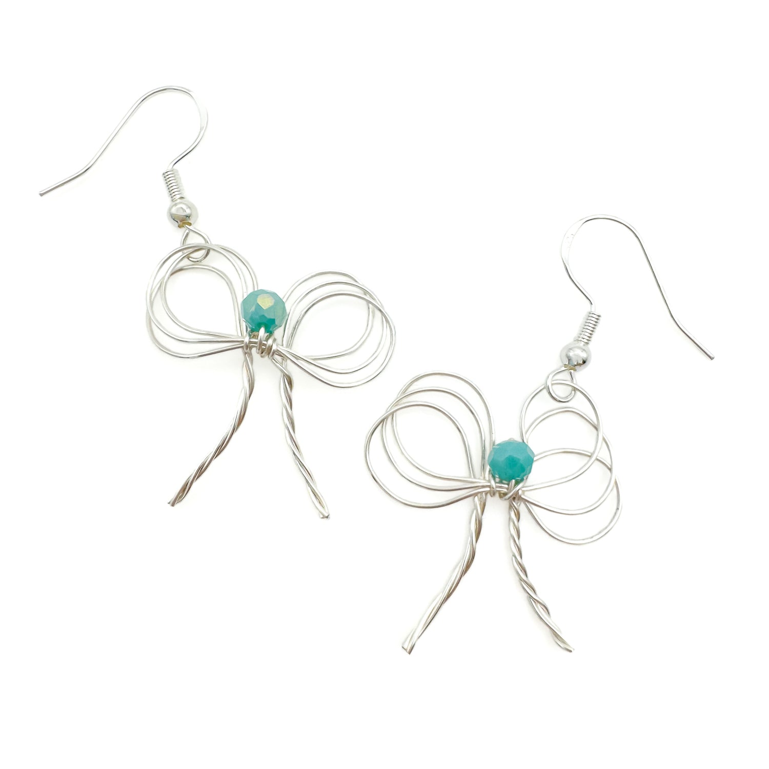 Silver wire bow dangle earrings with turquoise crystal