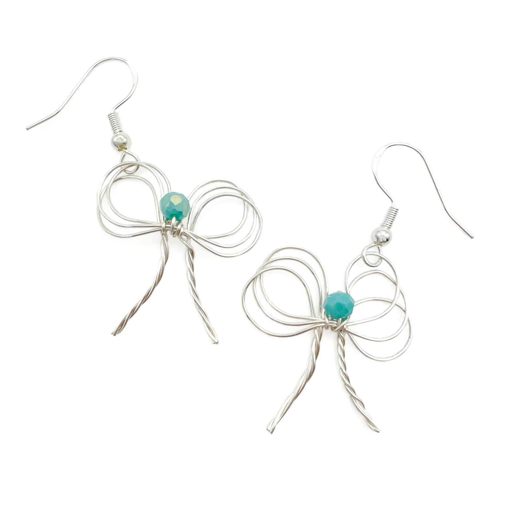 Silver wire bow dangle earrings with turquoise crystal