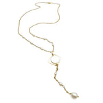 Long, gold y-shaped necklace with pearl stations, isometric mother of pearl pendant, and pearl drops