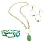 Green agate and gold jewelry set including teardrop dangle earrings, beaded helix stretch bracelet, and gold chain necklace with large aventurine pendant