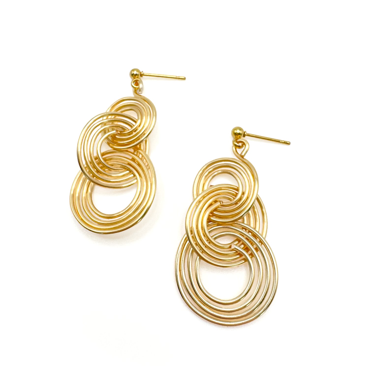 Large gold concentric circle geometric dangle earrings
