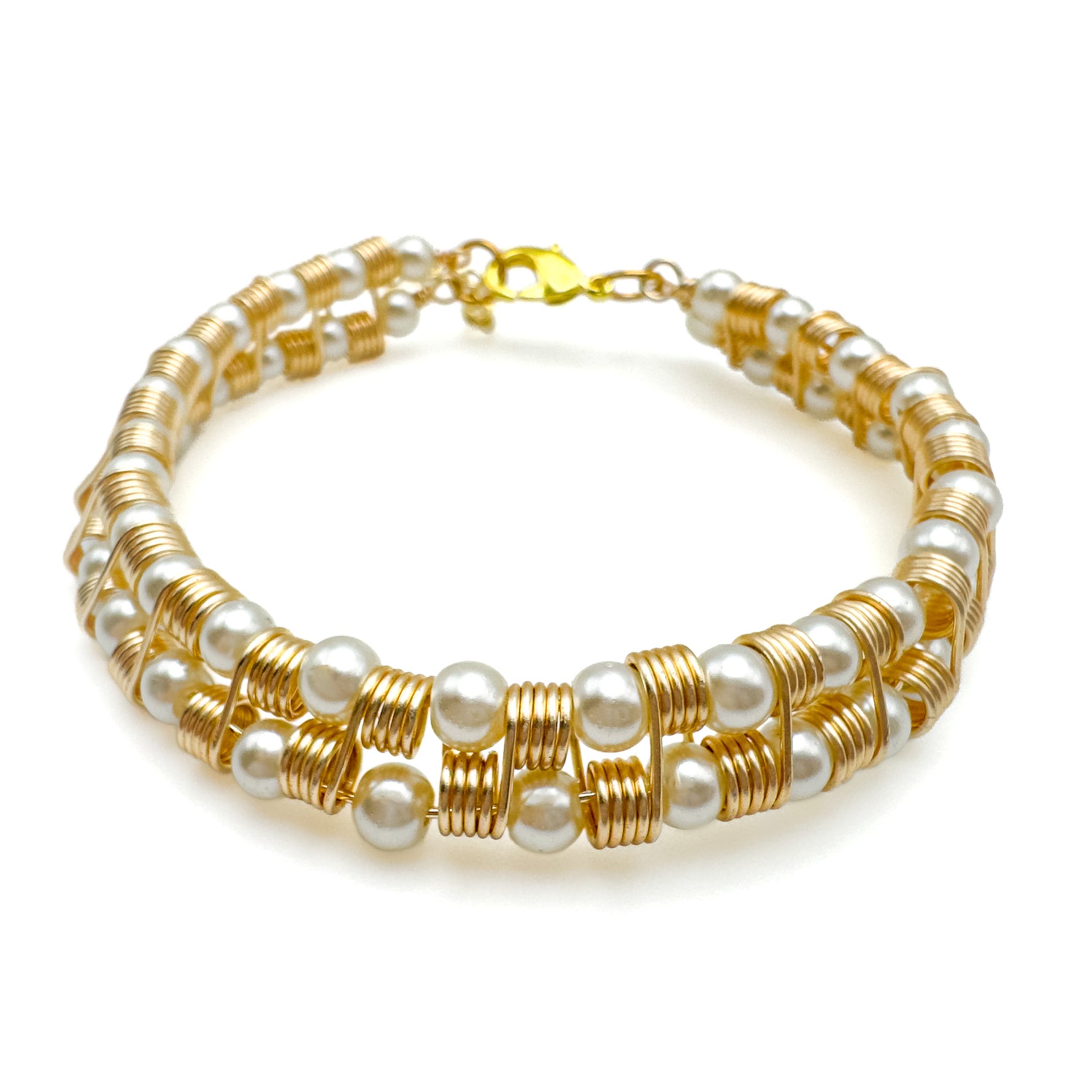Intricate gold and pearl geometric cuff bracelet