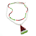 Multi-strand beaded necklace including white bead strand with watermelon-shaped pendant and red, green, and black beaded strand in a watermelon pattern
