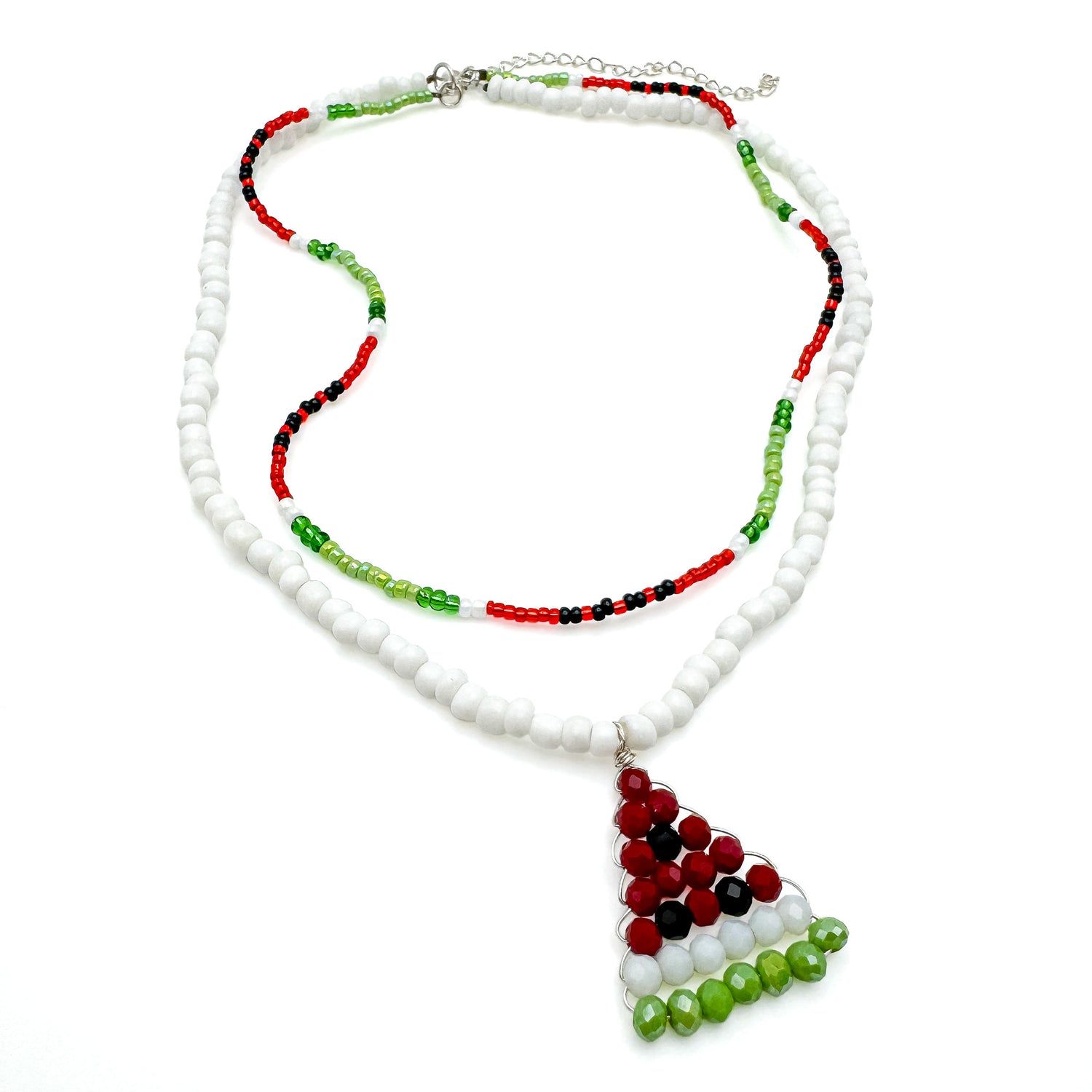 Multi-strand beaded necklace including white bead strand with watermelon-shaped pendant and red, green, and black beaded strand in a watermelon pattern