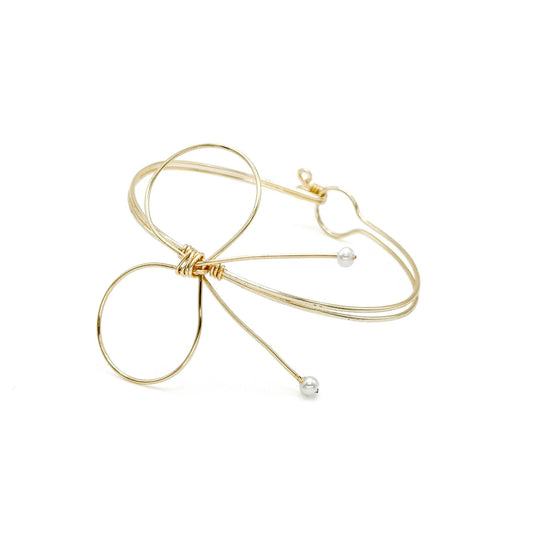 Pearl gold bow bangle bracelet