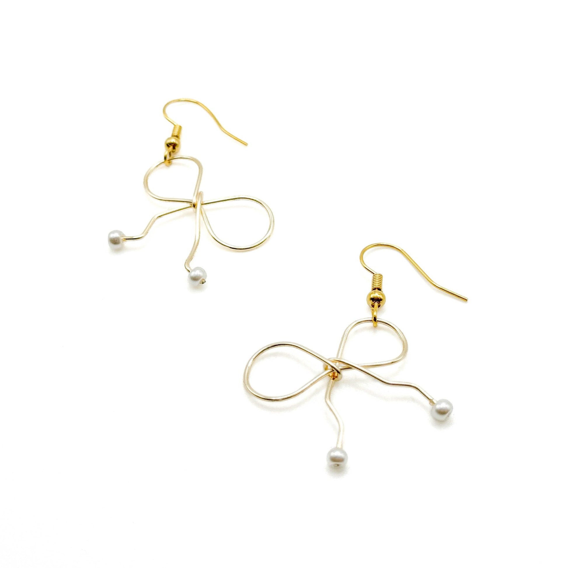 Pearl gold bow earrings