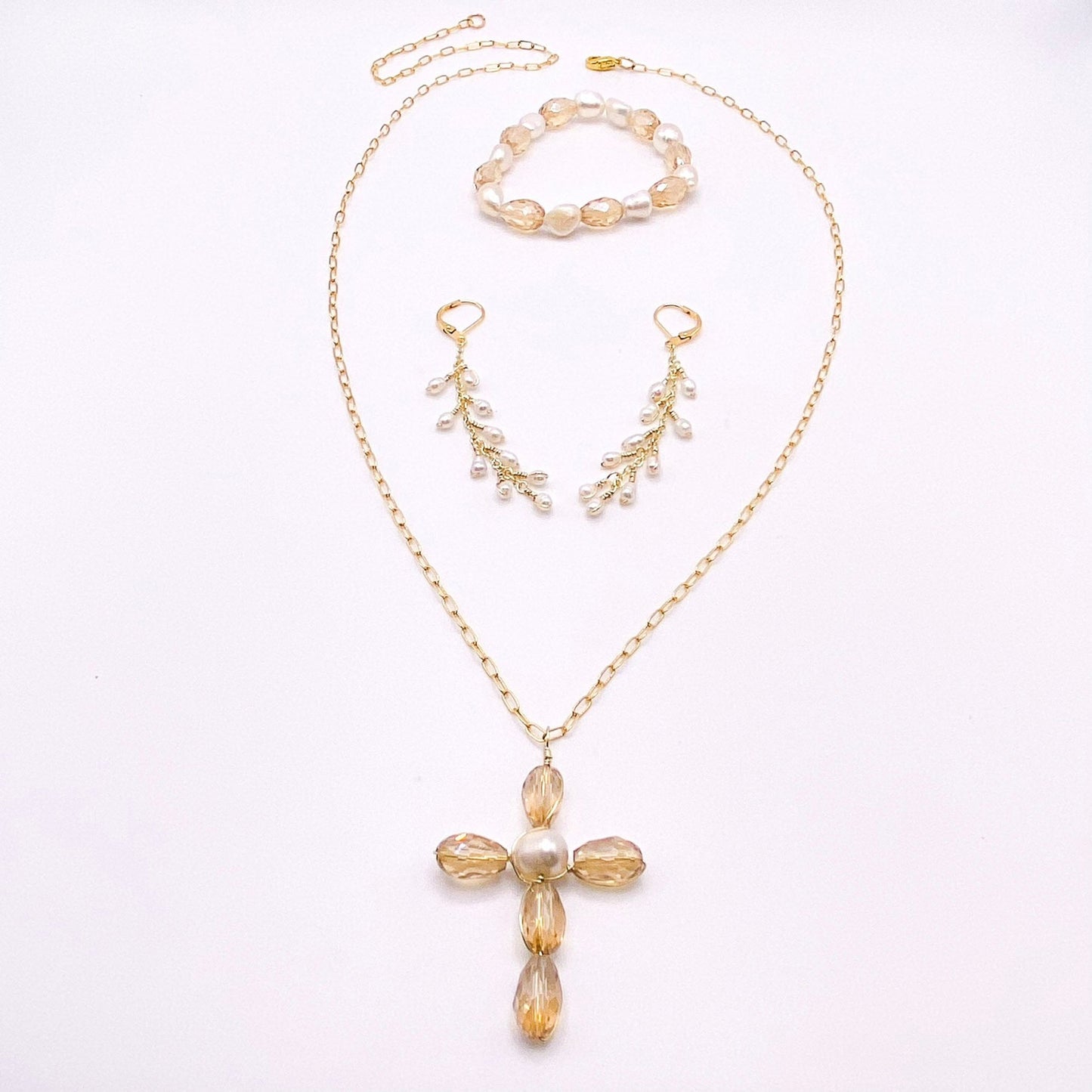 Tan pearl cross gold jewelry