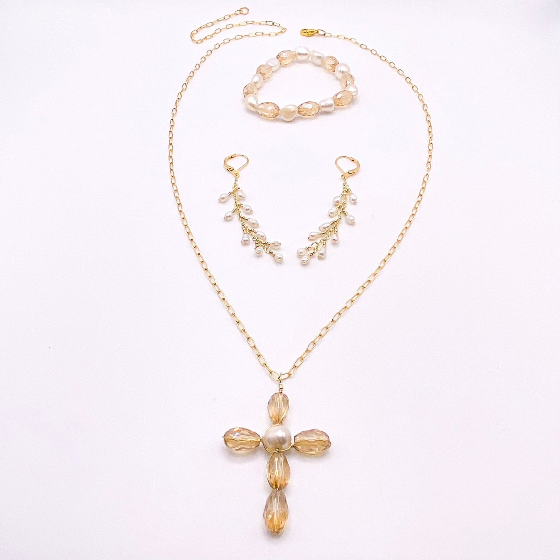 Tan pearl cross gold jewelry